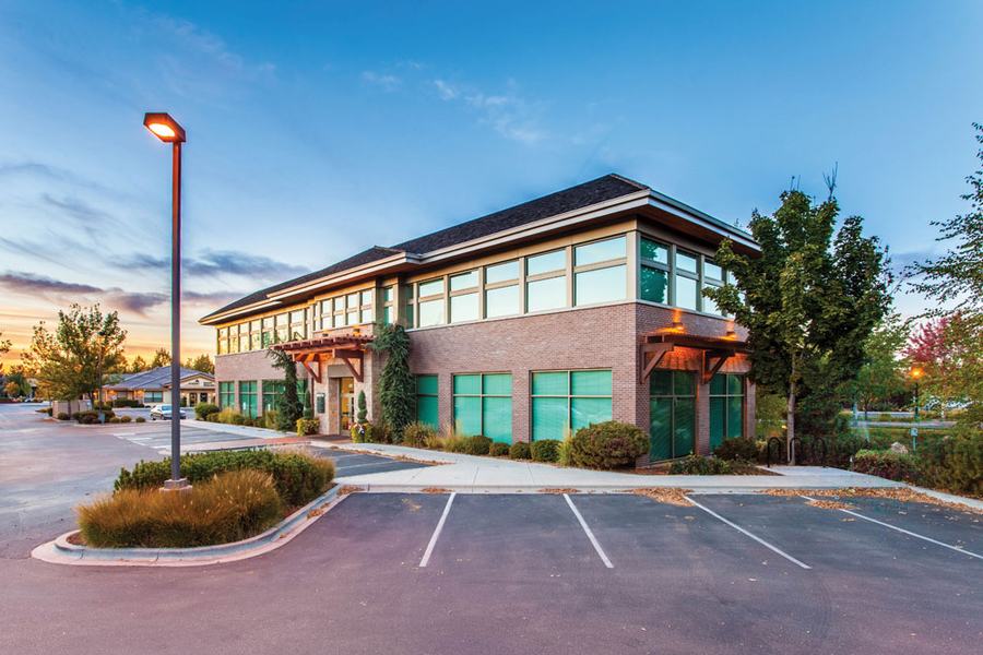 Commercial office building with a parking lot