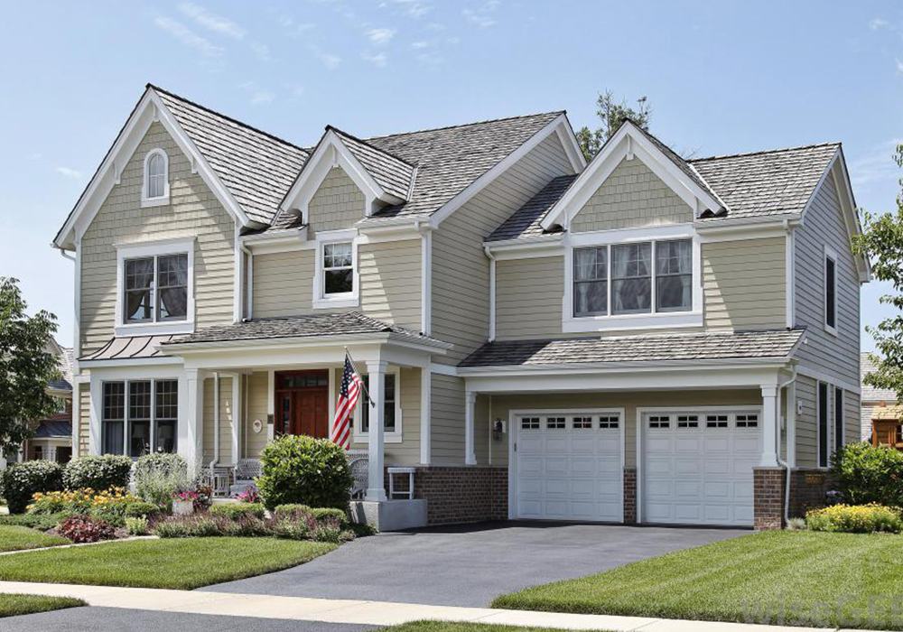 Well-kept two-story home with trimmed lawn