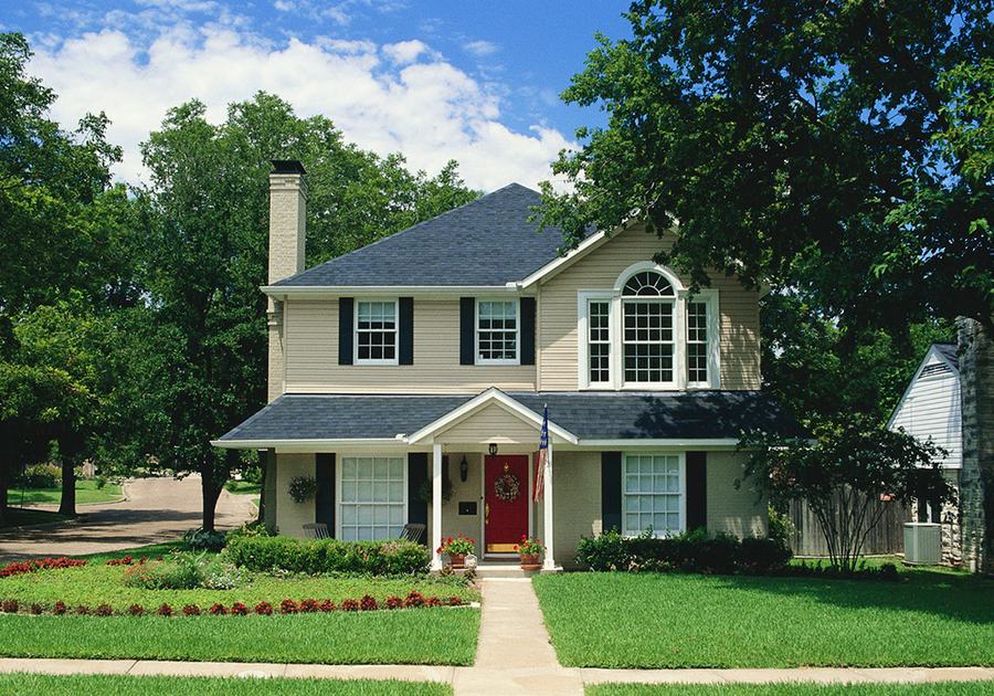 Two-story family home with a front lawn